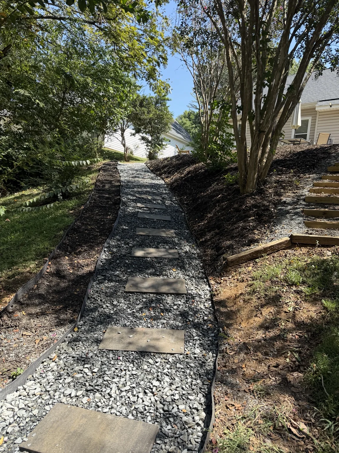 Stepping-stone walkway after stone and paver renovation